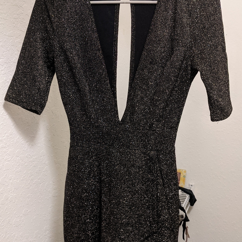 NWOT Windsor gray shimmer low cut romper.Very sexy and bold